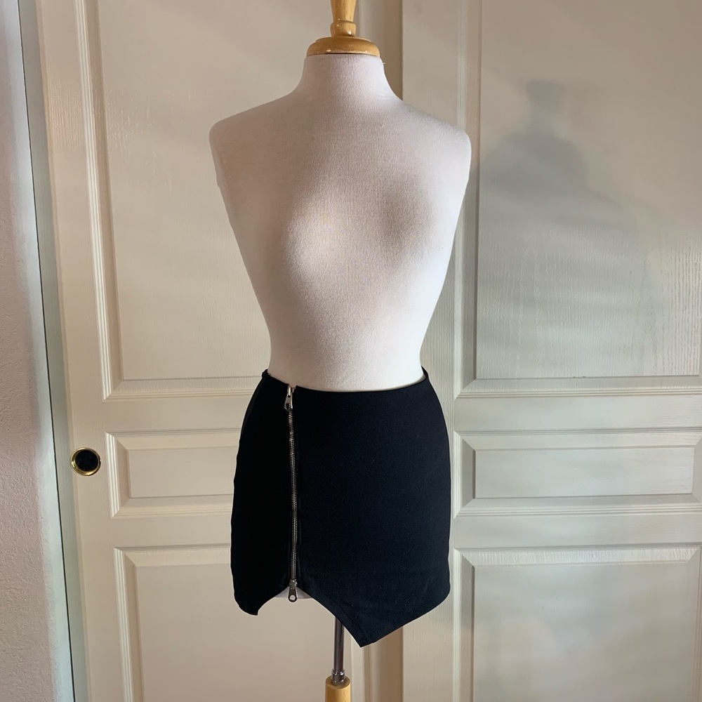 Black mini skirt with a silver zipper detail.